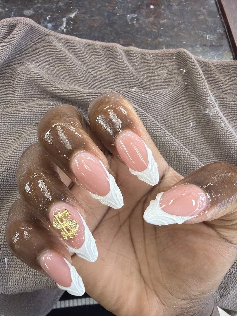 Polished nails displayed on a salon hand
